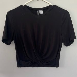Black cropped tee with front seam and wrap detail